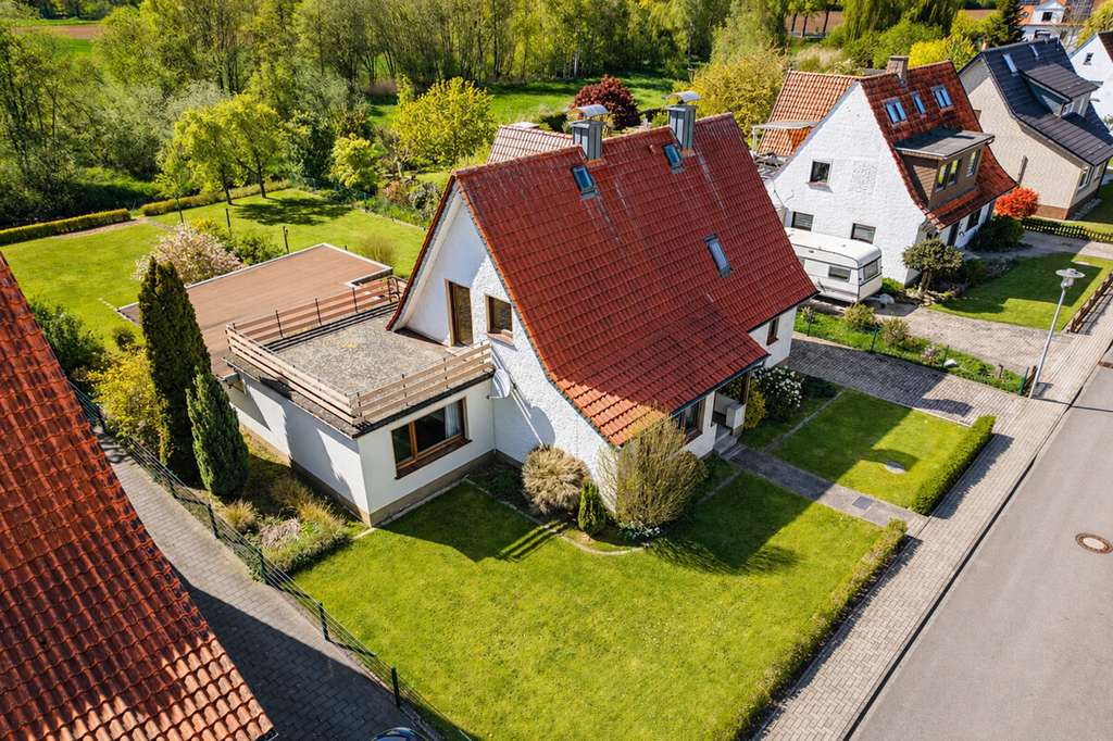 Immobilie in Bohmte - EFH in Bohmte: Modernisierungsobjekt mit großem Garten in Traumlage direkt an der Hunte! - Bild 0