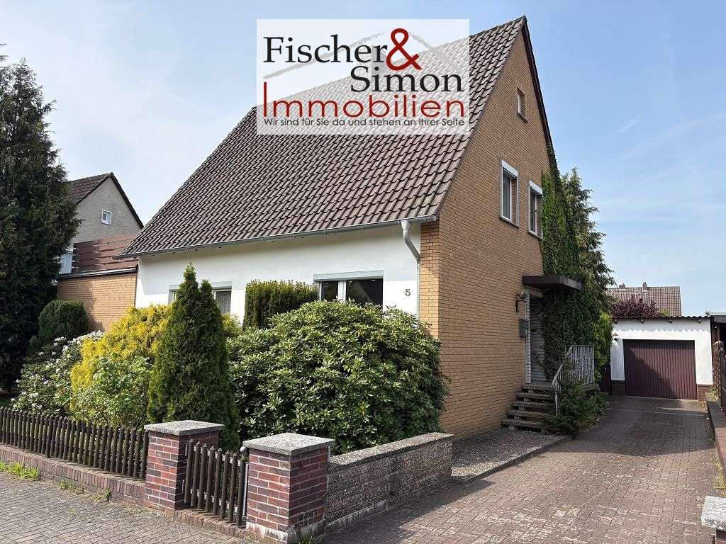 Immobilie in Rehburg-Loccum - Rehburg-Loccum: ansprechendes Einfamilienhaus m. Einliegerwohnung, Keller, Garage u. schönem Garten - Bild 0