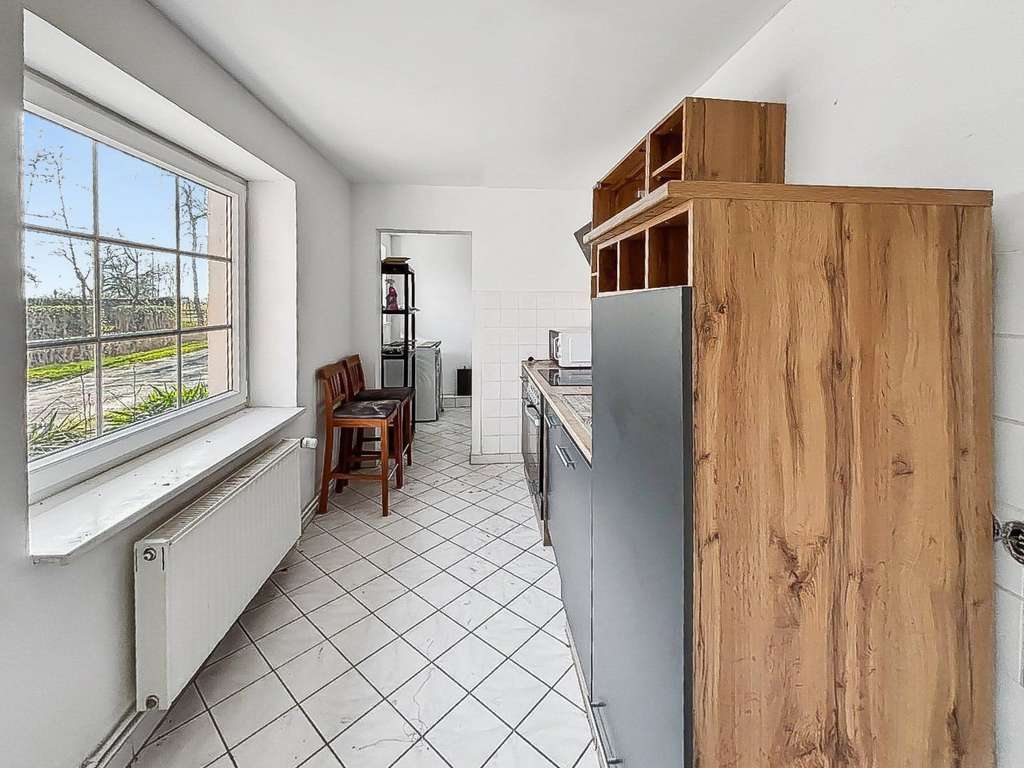 Immobilie in Butjadingen - Feines Wohnhaus auf ca. 1.527 m² Grund mit Sanierungsbedarf in Eckwarden nahe Nordseebad Tossens - Bild 4