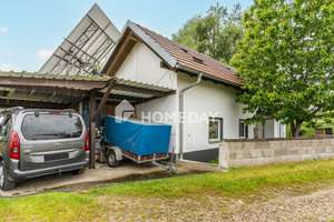 Zeitlos wohnen im Grünen – Einfamilienhaus mit überdachter Terrasse und Nebengebäude  – Die vollständige Adresse der Immobilie erhältst du vom Anbieter., 94099 Ruhstorf an der Rott – Vorschaubild 2