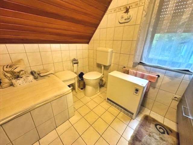 Immobilie in Nickenich - Charmantes Einfamilienhaus mit Garage, Garten und Nebengebäuden - Bild 7