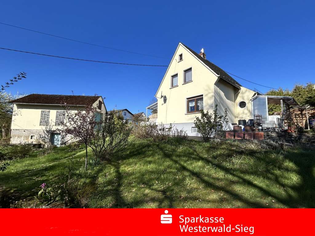 Immobilie in Horhausen (Westerwald) - Gemütliches Einfamilienhaus mit Garage in ruhiger Waldrandlage von Horhausen - Bild 0
