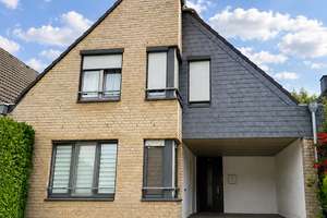 Einfamilienhaus mit Einliegerwohnung, Kamin und Terrasse – nahe dem Escher See