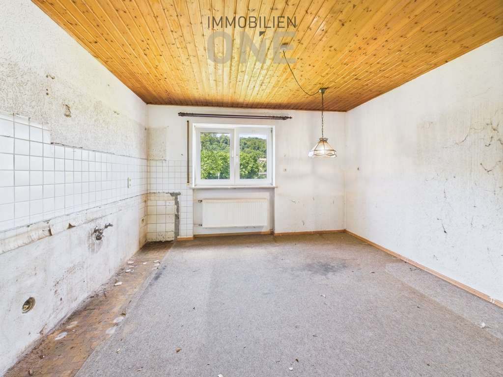 Immobilie in Nittendorf - 4-Zimmer Hochparterrewohnung mit Südterrasse und Garage - Bild 2