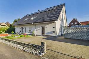 Wohnen mit Zukunft: Modernes Zuhause mit Einliegerwohnung und außergewöhnlicher Energieeffizienz – Die vollständige Adresse der Immobilie erhältst du vom Anbieter., 49479 Ibbenbüren – Vorschaubild 2