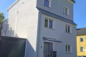 Neuwertige Erdgeschosswohnung mit Südterrasse und eigenem Gartenbereich