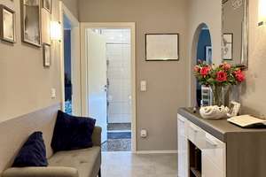 Modernisierte Erdgeschosswohnung mit Balkon und Tiefgaragenstellplatz