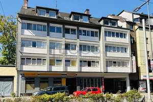 Attraktives Wohn- und Geschäftshaus in zentraler Lage mit 16 Einheiten, 12 Stellplätzen, 3 Garagen