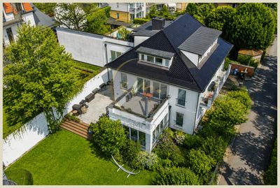 Wohnen und Arbeiten stilvoll verbinden: 3-Familien-Haus mit großzügigem Garten