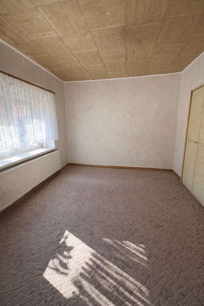 Immobilie in Wermsdorf - Einfamilienhaus in Dorfrandlage mit Garage und Garten – Teil eines sanierten Dreiseitenhofes - Bild 3