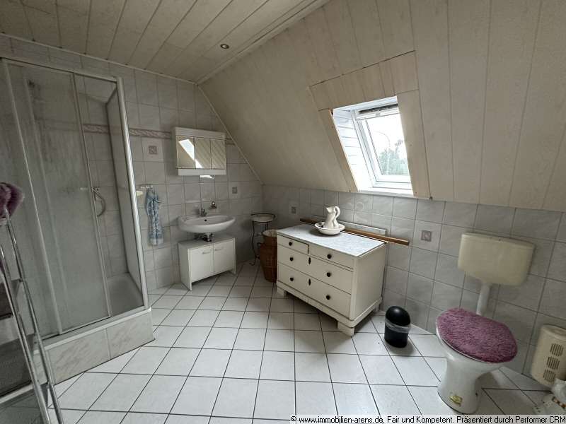 Immobilie in Apen - solides Klinkergebäude mit Garage und Wintergarten in Apen - Bild 8