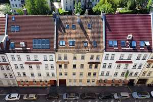 INVESTITION MIT PERSPEKTIVE | Geteiltes Mehrfamilienhaus mit 8 Einheiten und grünem Innenhof