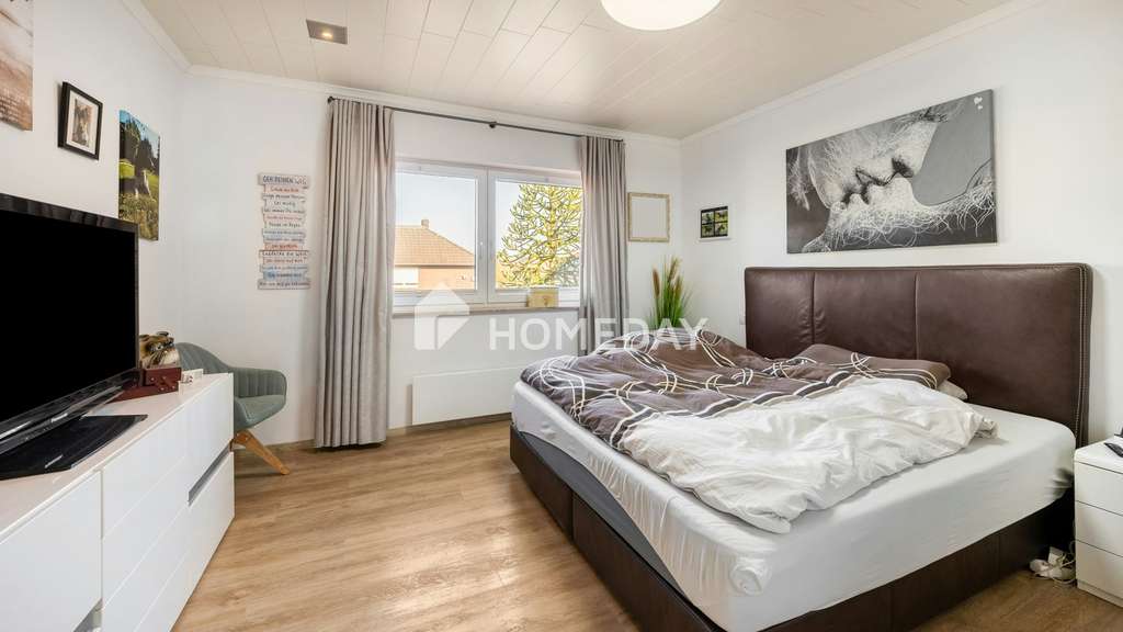 Immobilie in Lastrup - Stilvoll modernisiertes Einfamilienhaus mit großzügigem Garten, Terrassen und Solaranlage - Bild 1