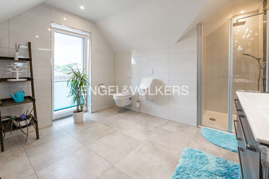 Immobilie in Esterwegen - Familientraum auf zwei Ebenen – Großzügiger Bungalow mit Dachausbau und Garten - Bild 4