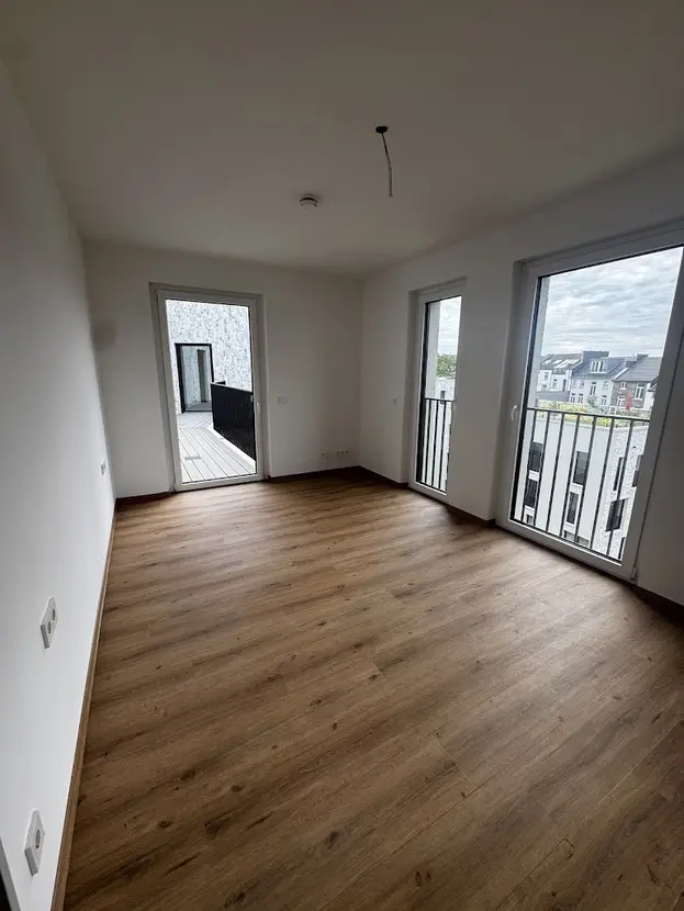 Exklusive 3-Zimmer-Wohnung im Neubau mit Dachterrasse & Aufzug - Photo 3