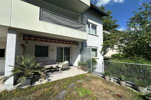 Familienfreundliche 4-Zimmer-Eigentumswohnung mit Terrasse, Gartenanteil, Garage und Keller