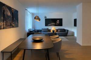 Loftartige 115 m² Gartenwohnung mit 60 m² Wohnbereich, Kamin & Pool, hochwertig möbliert