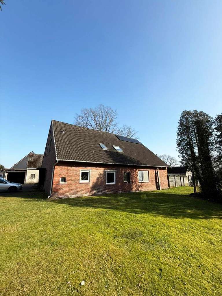 Immobilie in Loxstedt - Zweifamilienhaus mit PV-Anlage & großem Südgrundstück - Bild 1