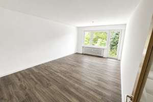 Modern saniert, ruhig gelegen, bestens angebunden - 2-Zimmer Wohnung mit Tiefgarage in BMW Nähe