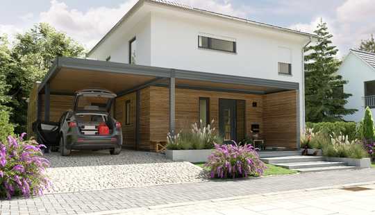 Bild von Das Stadthaus mit Anbau und Carport.
