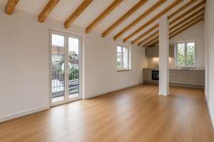 AIGNER - 3-Zimmer-Dachgeschosswohnung mit hohen Decken, Südterrasse und offenem Wohngefühl