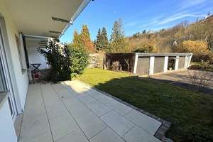 Maisonette-Wohnung mit eigenem Garten & Garage in zentraler Lage