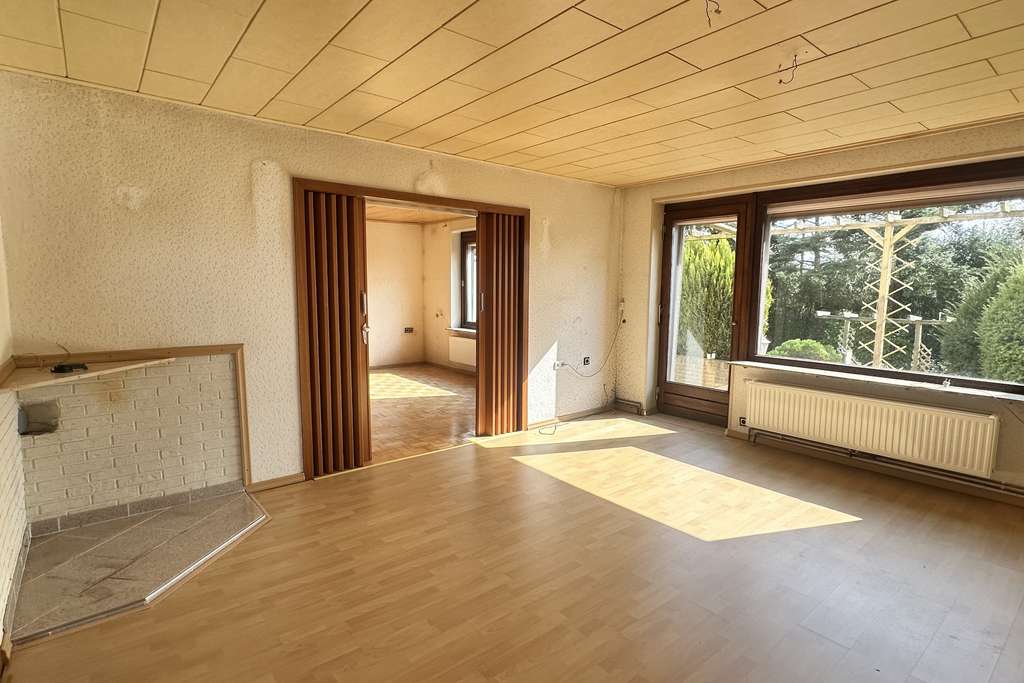 Immobilie in Stockelsdorf - Einfamilienhaus mit vermieteter Einliegerwohnung  - Bild 1