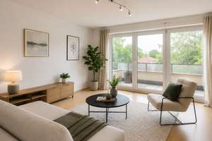 Helle 2,5-Zimmer-Dachgeschosswohnung mit großer Terrasse, Einbauküche und Tiefgaragenstellplatz