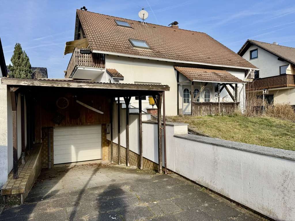 Immobilie in Münster (Hessen) - Freistehendes Einfamilienhaus mit
Einliegerwohnung, Garage & großer Terrasse - Bild 3