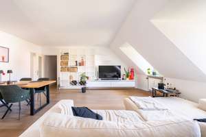 AIGNER - Rarität in Bestlage: Charmante Erbpacht-Dachgeschosswohnung am Nymphenburger Schlosskanal