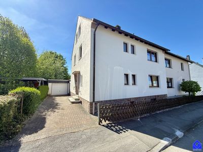 Doppelhaushälfte als 2-Fam.-Haus, unterkellert und Garage