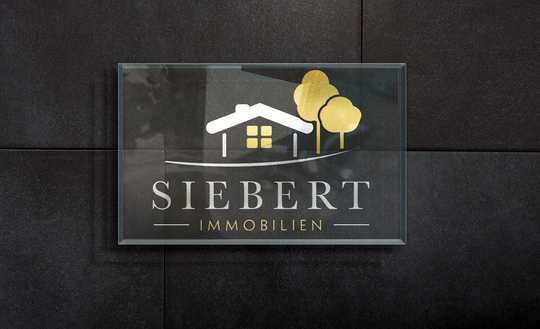 Großzügiges Grundstück mit zwei Wohnhäusern und Scheune