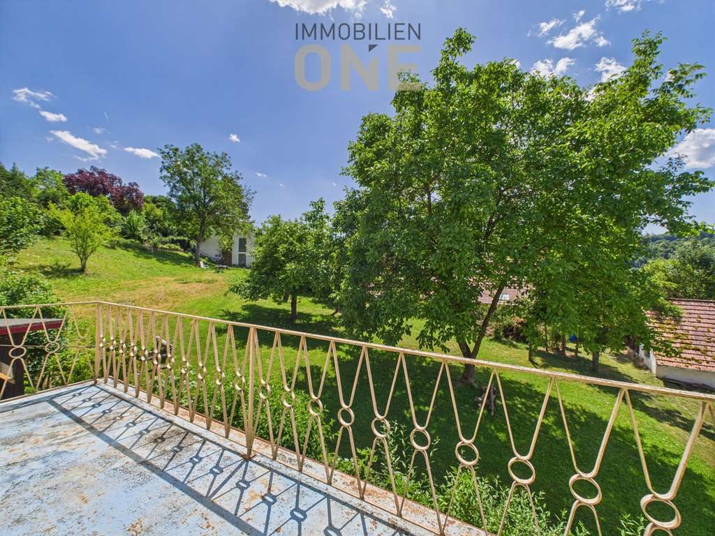 Immobilie in Nittendorf - 4-Zimmerwohnung mit Südbalkon und Einzelgarage - Bild 1