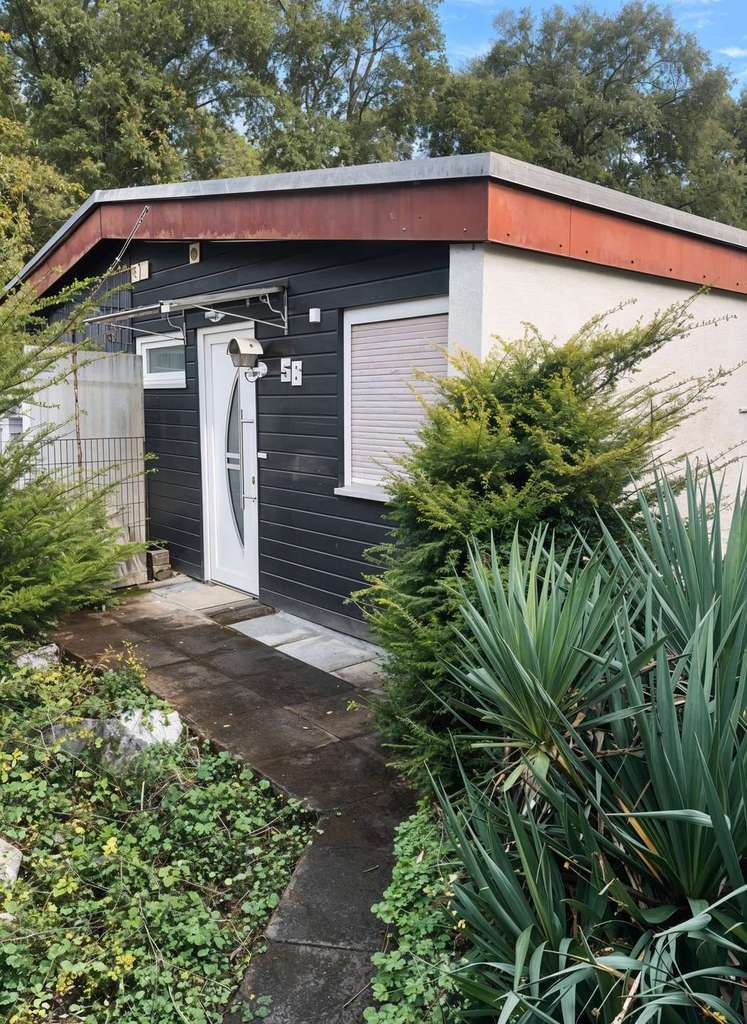 Immobilie in Braunfels - Idyllischer Charme trifft teilsaniertes Bungalow / Reihenmittelhaus - inkl. neuer Einbauküche - Bild 1