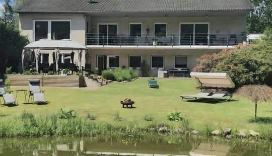 Bild von Modernisiertes Einfamilienhaus mit eigenen Teich und kleinem Waldstück in privater Lage