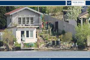Gepflegtes Wassergrundstück mit zwei Ferienhäuser auf Eigentumsland, Strand, Steg und Outdoorküche – Müritz (Kreis) – Vorschaubild 1