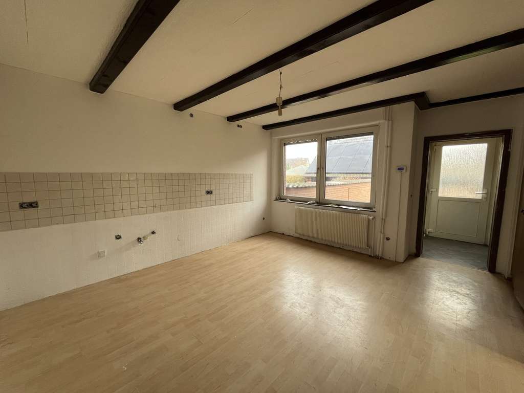 Immobilie in Xanten - Einladendes Einfamilienhaus mit Einliegerwohnung, Keller, Garage und Garten - Bild 4