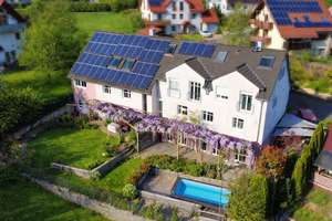 Familientraum mit Mieteinnahmen – Hochwertiges MFH mit 4 Einheiten und Top-Energieeffizienz – Die vollständige Adresse der Immobilie erhältst du vom Anbieter., 63773 Goldbach – Vorschaubild 2