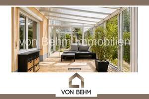 Charmante Erdgeschosswohnung mit eigenem Garten, Wintergarten und Doppel-Carport