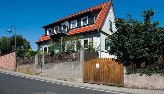 Bild von Einfamilienhaus mit Herz und einem zauberhaften Garten