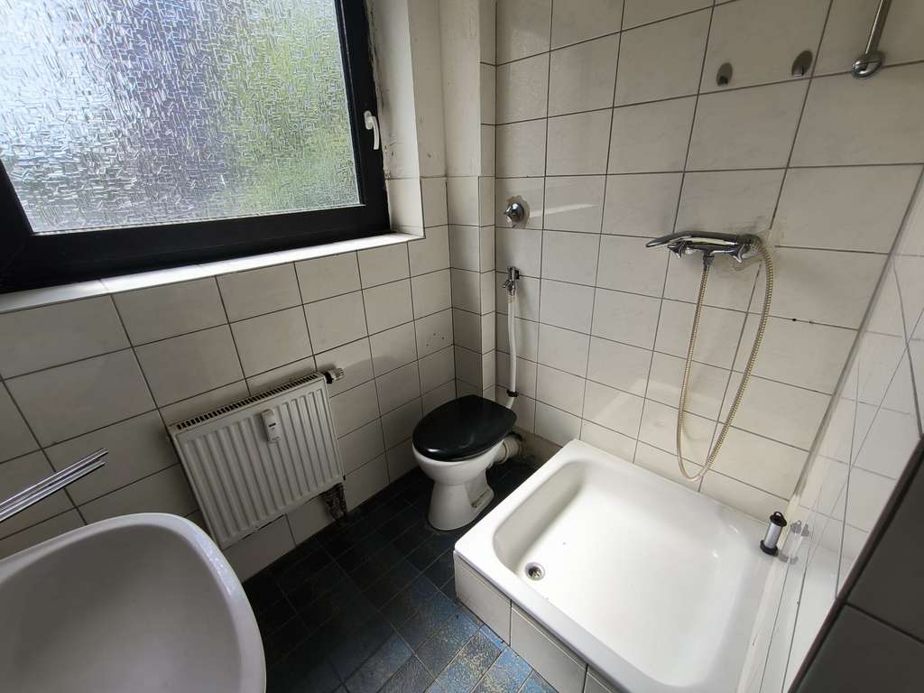 Immobilie in Übach-Palenberg - MGI - Sanierungsbedürftige Eigentumswohnung in Übach-Palenberg - Bild 1