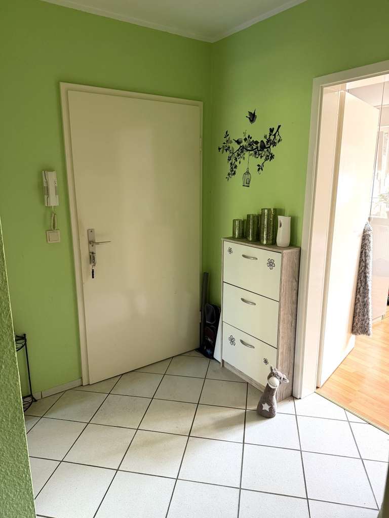 Immobilie in Elmenhorst - Gut vermietete 2- Zimmer Erdgeschosswohnung mit S- W Terrasse, eigenem Gartenanteil und Stellplatz - Bild 3