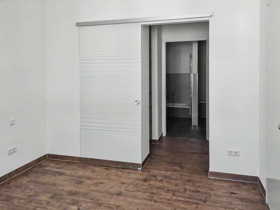 Schlafzimmer mit Glasschiebetü