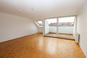 Dachgeschosswohnung mit offenem Wohnkonzept und ruhiger Loggia im Denkmal