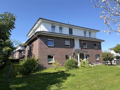Erstklassig wohnen in einer top ausgestatteten 3- Zi. Whg mit SW-Terrasse, Garten, Fahrstuhl u. C...