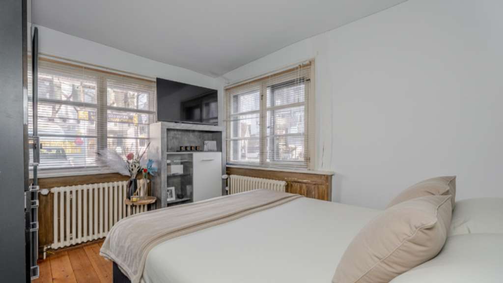 Immobilie in Konstanz - Dein Rückzugsort in Konstanz-Wollmatingen: 2-Zimmer-Wohnung mit Altbauflair und guter Anbindung! - Bild 1