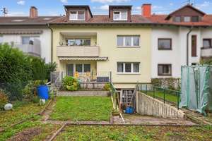 Viel Raum für Ideen: Attraktives Mehrfamilienhaus mit Garten und Werkstatt