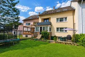 Erdgeschosswohnung mit Wintergarten und Garten