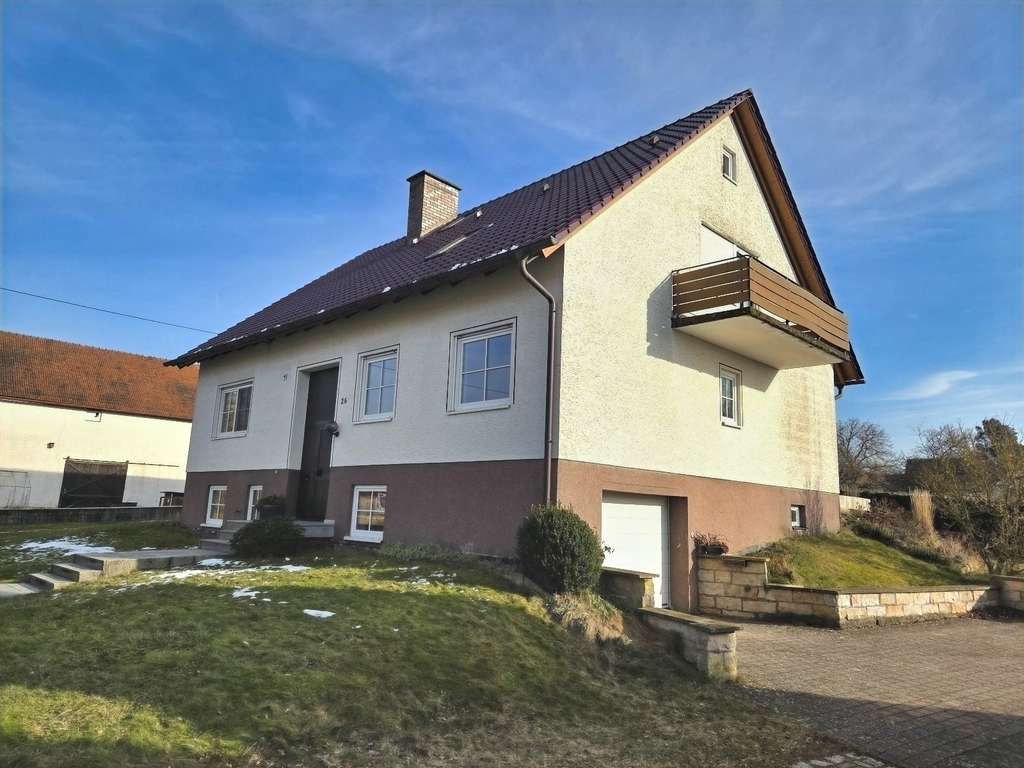 Immobilie in Burgpreppach - Haus am See mit Ausbaupotential (Wfl. 110 m²) inkl. Gartengrundstück und mehreren Nebengebäuden i - Bild 0