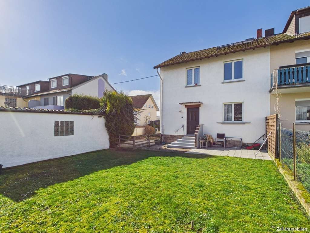 Immobilie in Geisenheim - Doppelhaushälfte zum Wohlfühlen mit schönem Garten in beliebter Wohnlage - Bild 1